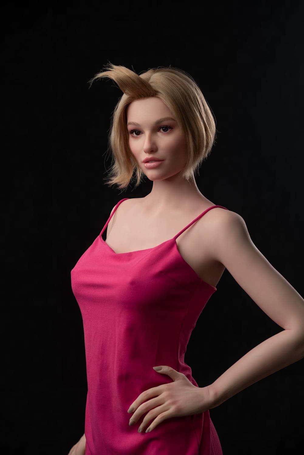 Секс-лялька Masha фото 7 - SexDolls.com.ua Секс лялька Masha в рожевій сукні стоїть біля крісла і дивиться убік